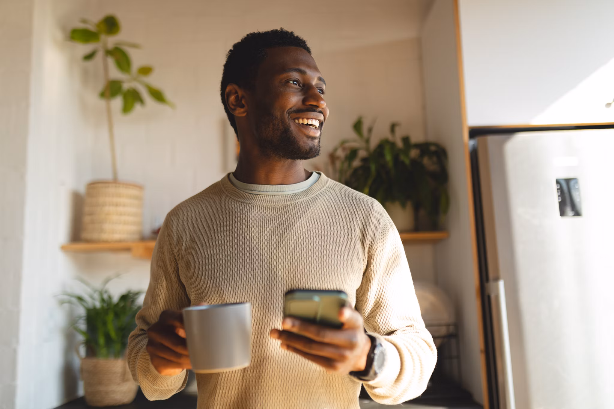 man holding a mug of coffee