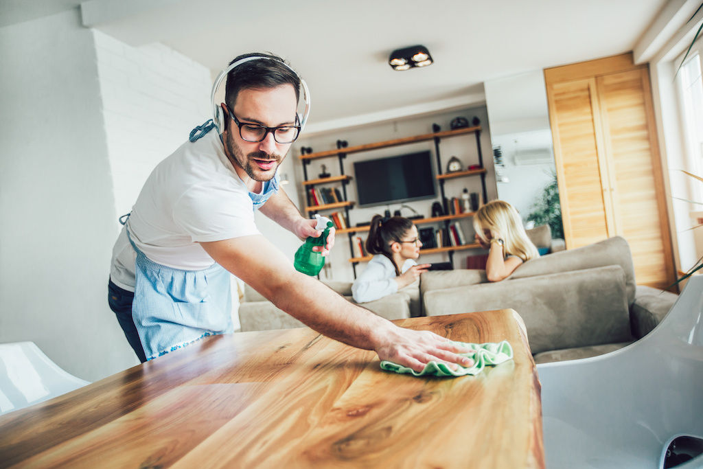 Man Wiping Down Table