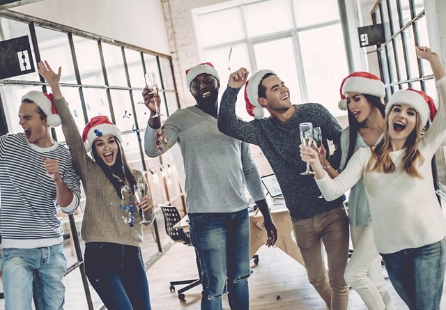 Enjoying Holiday Work Party in Santa Hats | Blog | Greystar