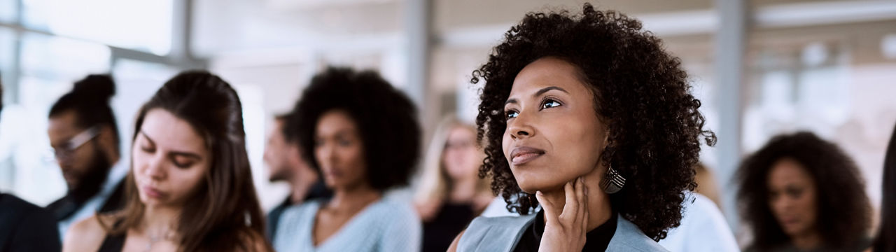 Shot of a businesswoman listening intently during a conference