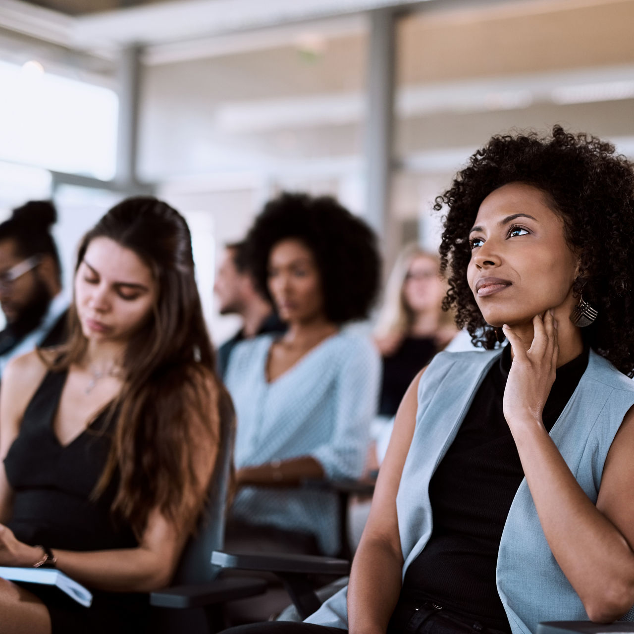Shot of a businesswoman listening intently during a conference