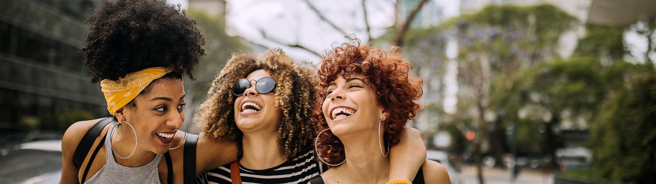 Three girlfriends having fun in the city