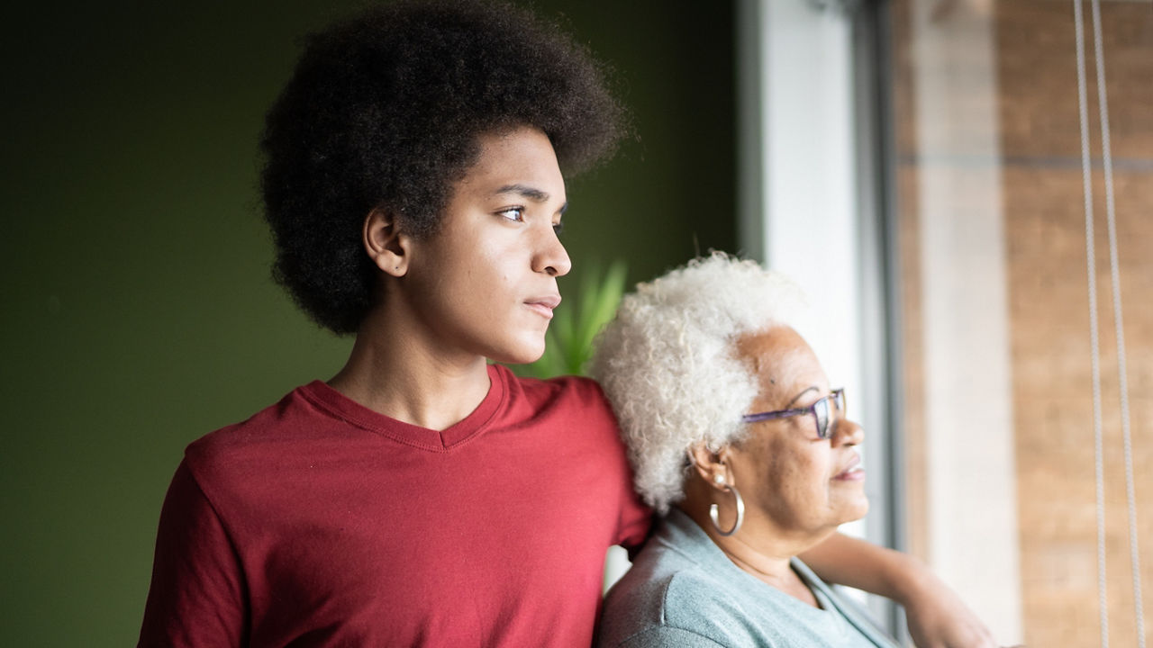 Grandmother and grandson contemplating at home