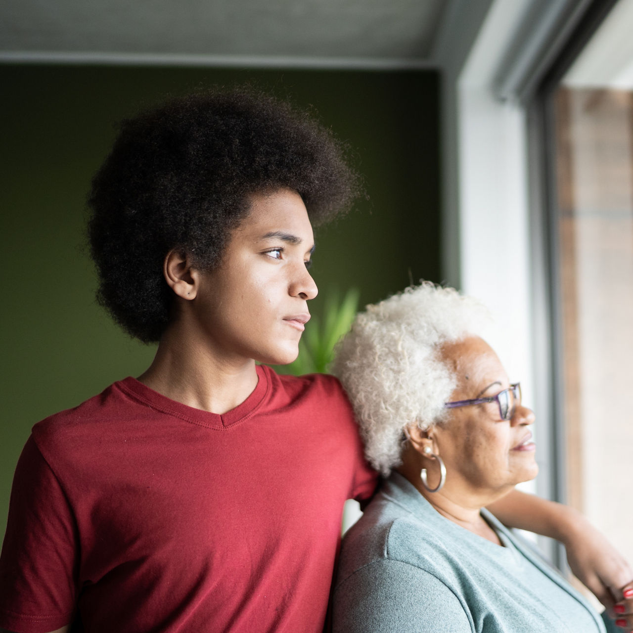 Grandmother and grandson contemplating at home
