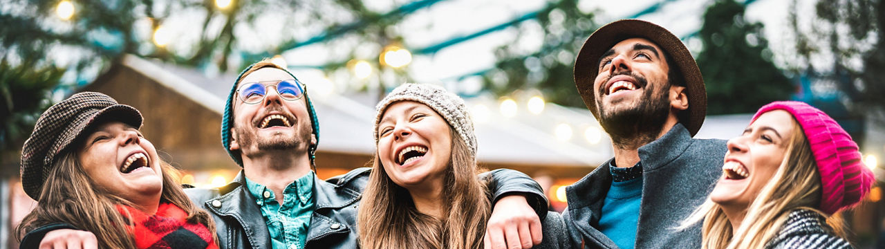 Millennial friends group walking at London city center - Next generation friendship concept on multi-cultural young people wearing winter fashion clothes having fun together outside