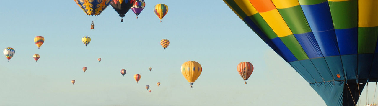 Hot Air Balloons in Albuquerque, New Mexico at the International Balloon Festival, taking off at different times making them appear close and far away.