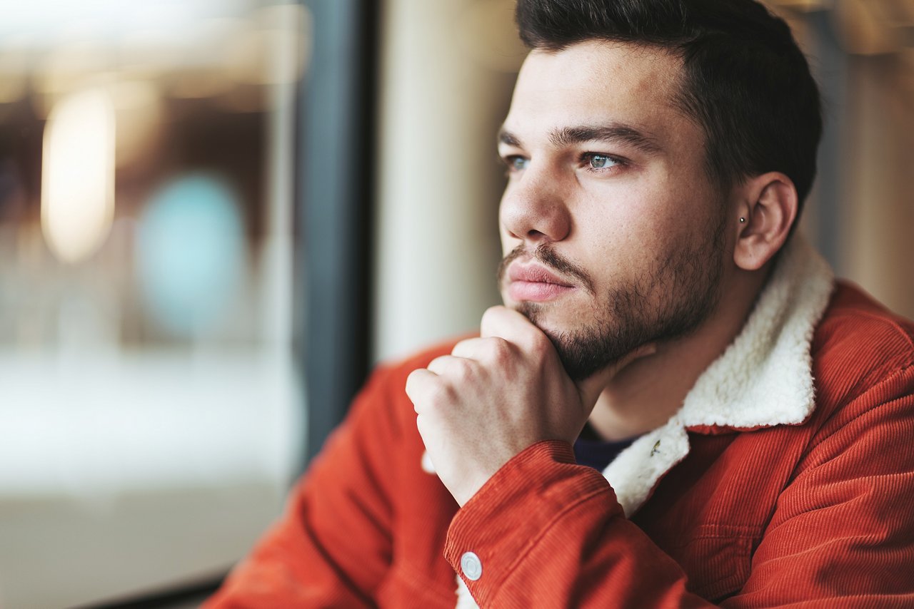 Portrait of pensive man, Looking through window, man, introspective, beard, mustache, jacket, male, men, thought, thoughtful, pensive, deep, meditation, serious, indoors, inside, interior, hispanic, casual, dark hair, portrait, window, looking, searching, single, alone, one, lonely, quiet, sad, waiting, adult, young adult