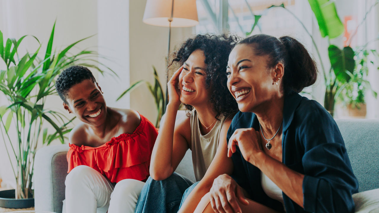 Happy beautiful hispanic south american and black women meeting indoors and having fun - Black adult females best friends spending time together, concepts about domestic life, leisure, friendship and togetherness