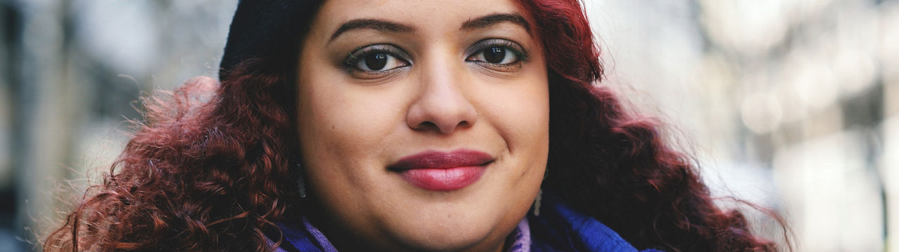 Portrait of a young woman looking at the camera with confidence.