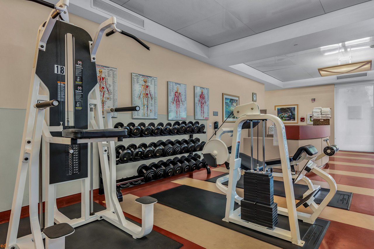 Inside a gym with weights and several exercise machines