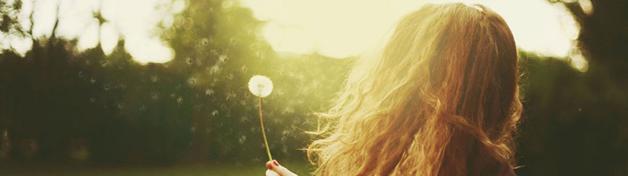 person with dandelion