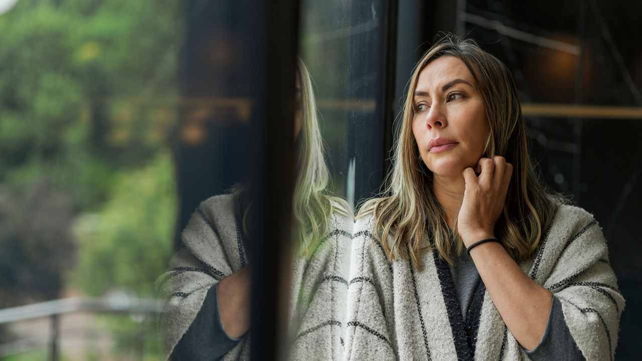 Woman looking out window