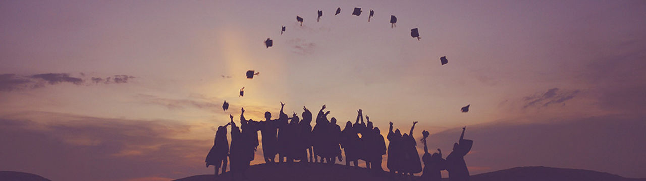 graduates throwing cap