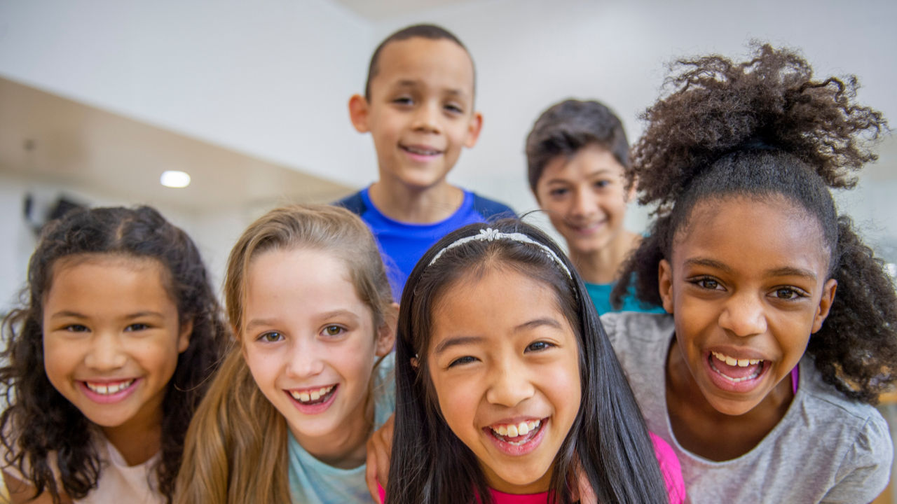 Diverse group of elementary aged kids in fitness class