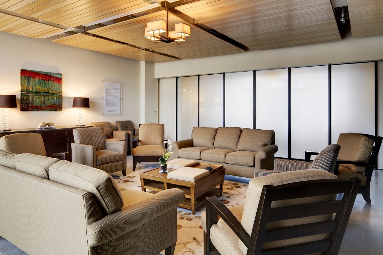 A view of the Naples group room with comfortable chairs and sofas