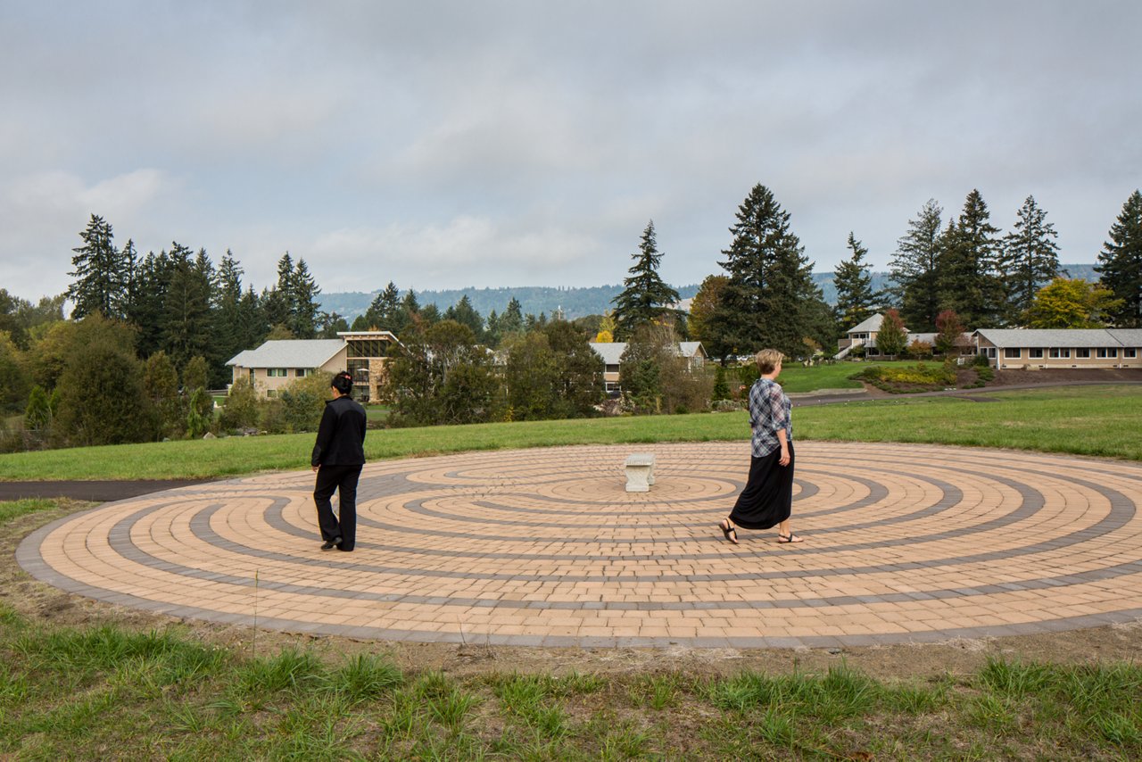 A meditation garden with two individuals 