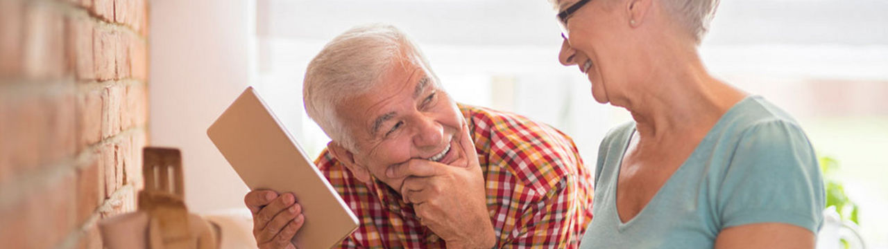Elderly couple with tablet