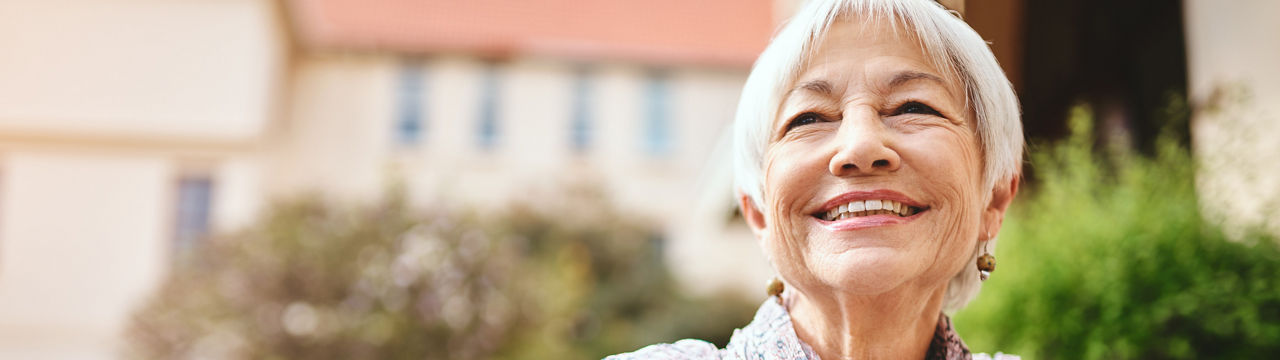 Shot of a senior woman relaxing outside in the garden of a retirement home