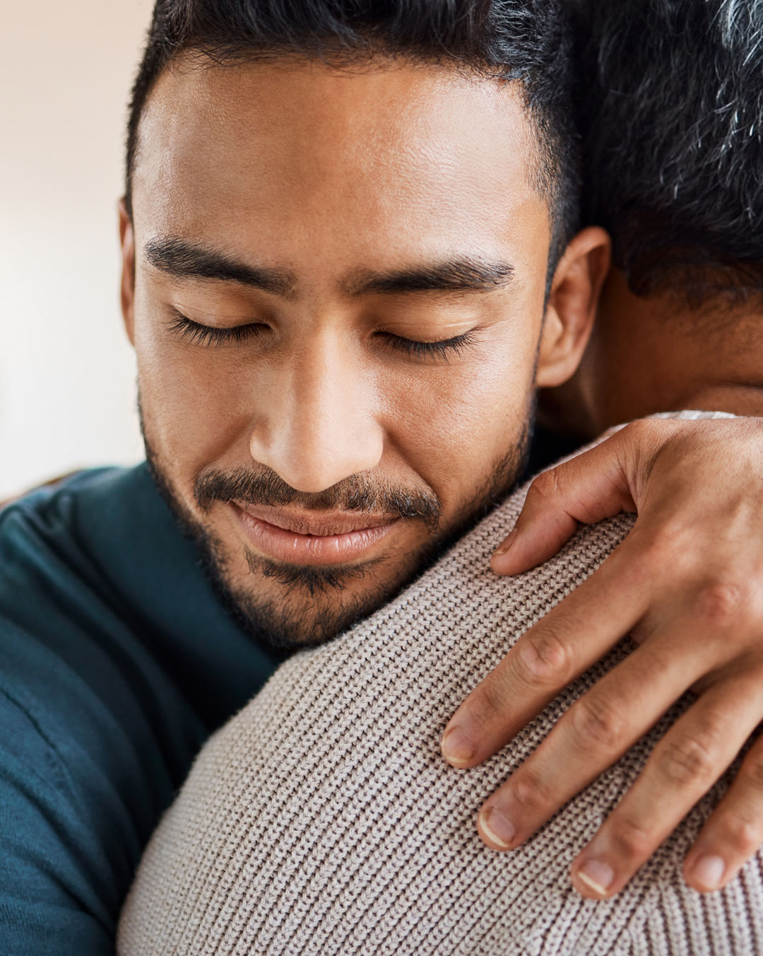 Two men embracing in a hug