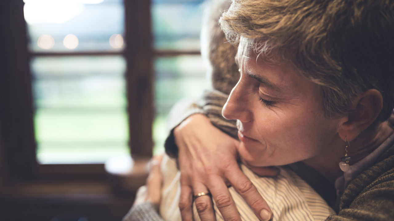 ID 342, Senior couple embrace themselves in their kitchen