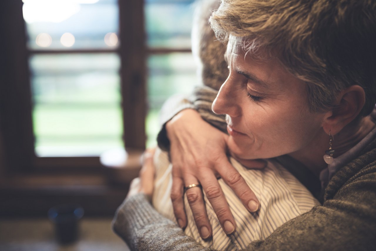 ID 342, Senior couple embrace themselves in their kitchen