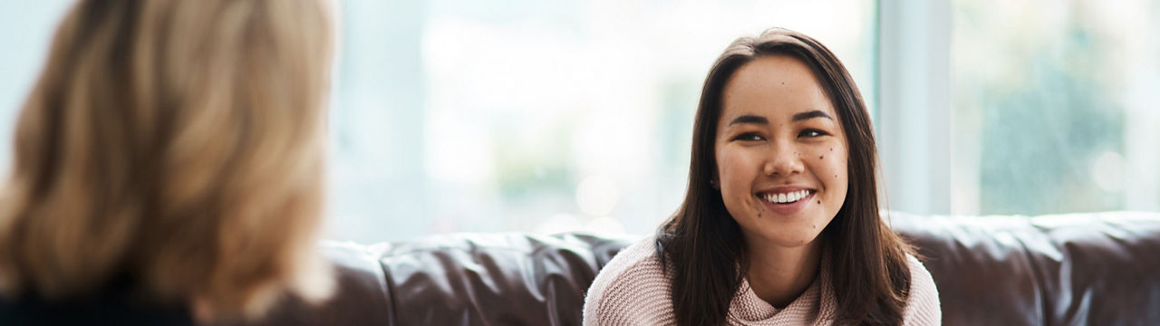 Shot of a young woman having a therapeutic session with a psychologist