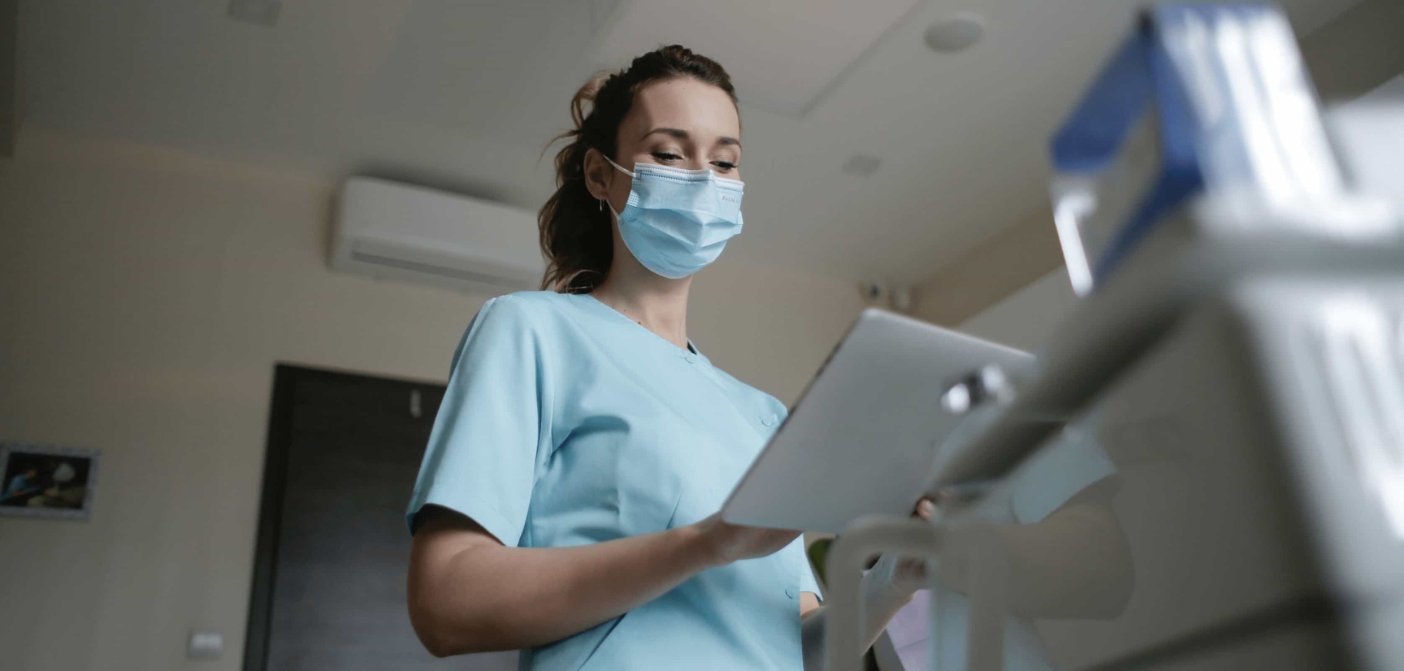 Female healthcare provider looking at a chart