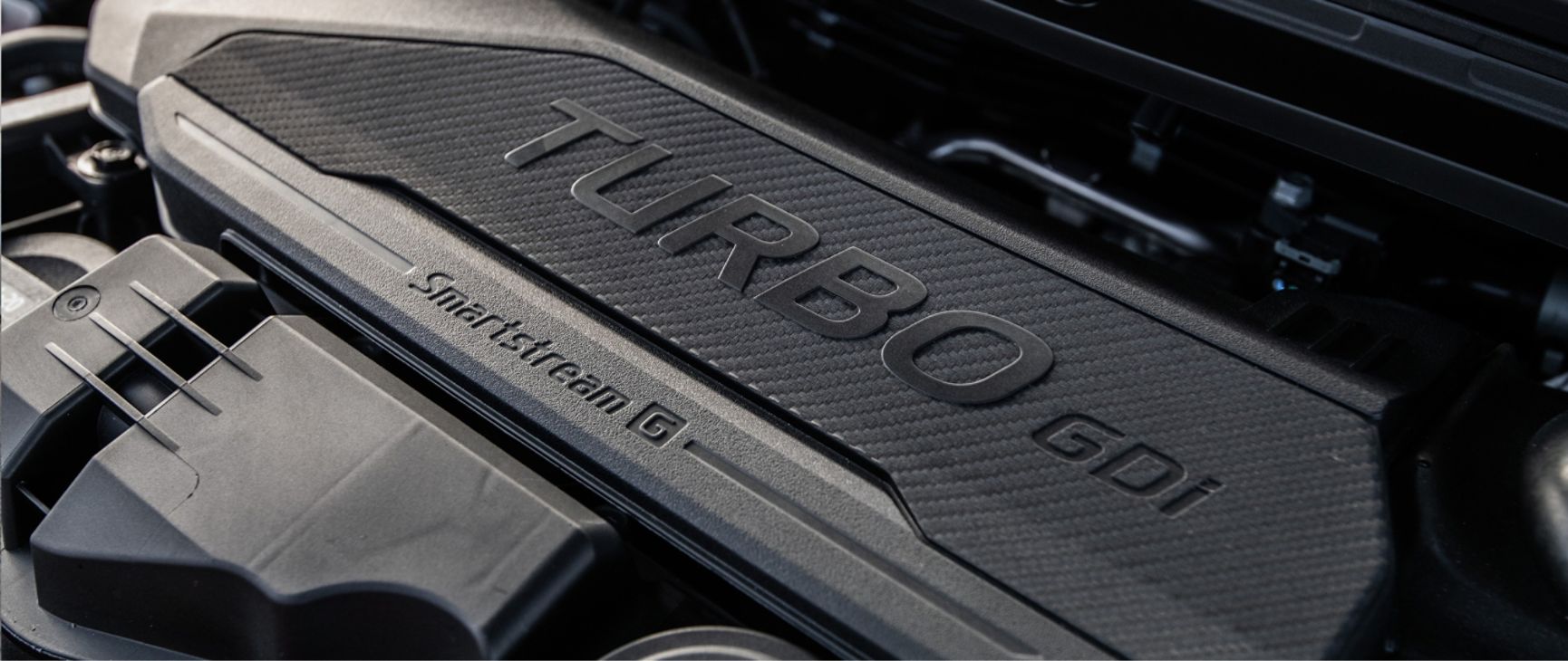 Zoomed in view of the turbocharged engine under the hood