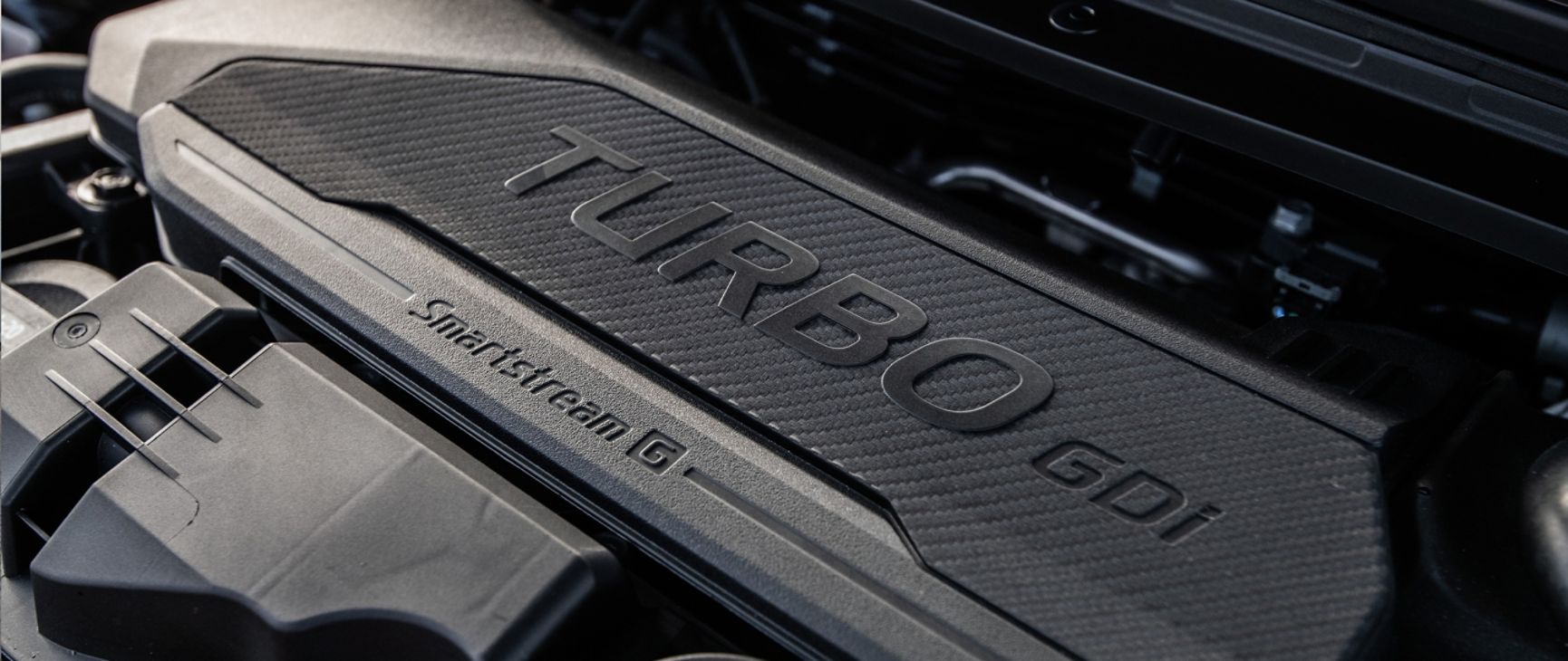 A close up shot of the available Turbocharged Engine from the 2026 K4 Hatchback GT-Line Turbo which offers responsive performance and confident acceleration with 190 HP.
