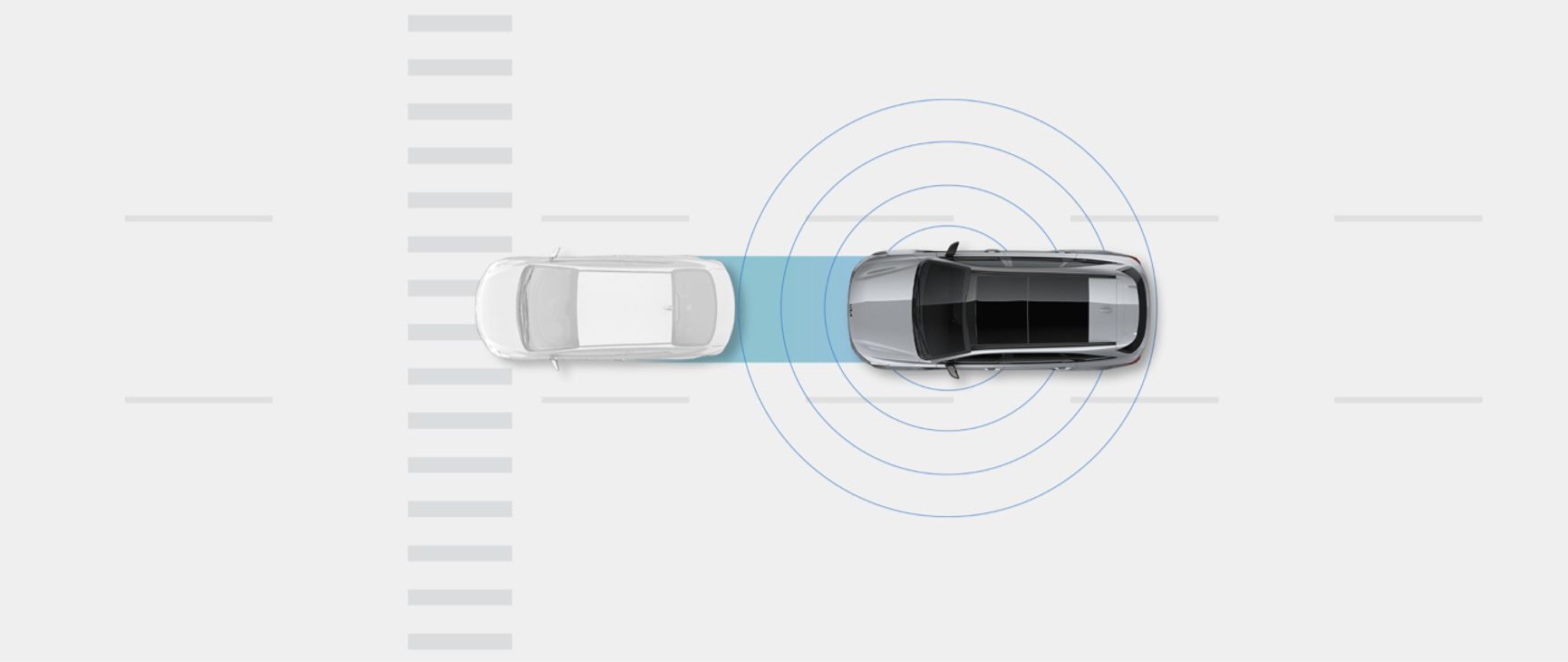 Kia vehicle in a bird's-eye view behind a generic car, with rings around it to show how the car detects a potential collision