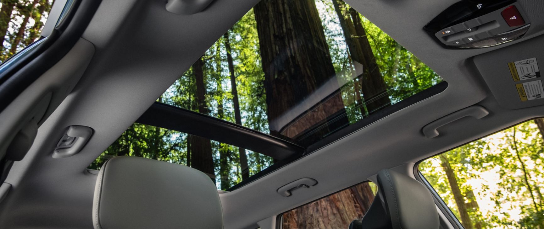 The 2027 Kia Seltos features a panoramic sunroof that fills the cabin with natural light, creating a bright and open interior feel while showcasing the surrounding outdoor scenery.
