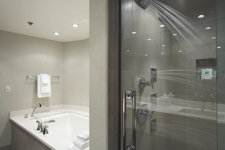 A shower and tub combo in a Woodlake Suite at Inn on Woodlake