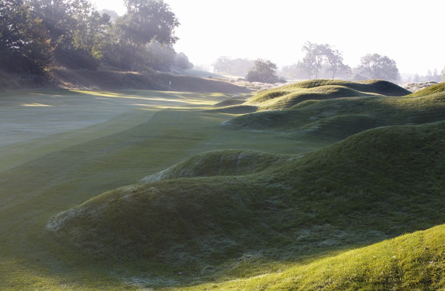 The fariway near the green of the second hole on the River Course hazy sunshine. 