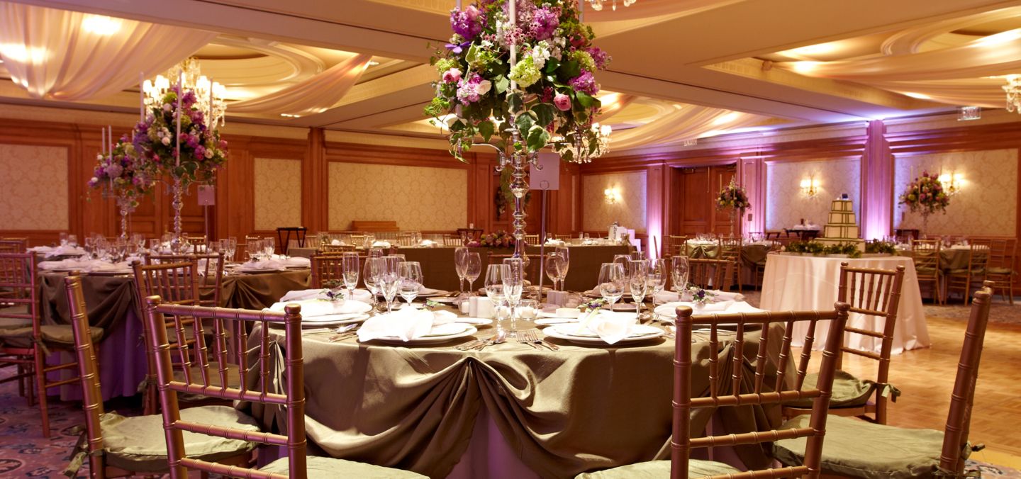 a wedding reception setup in a ball room