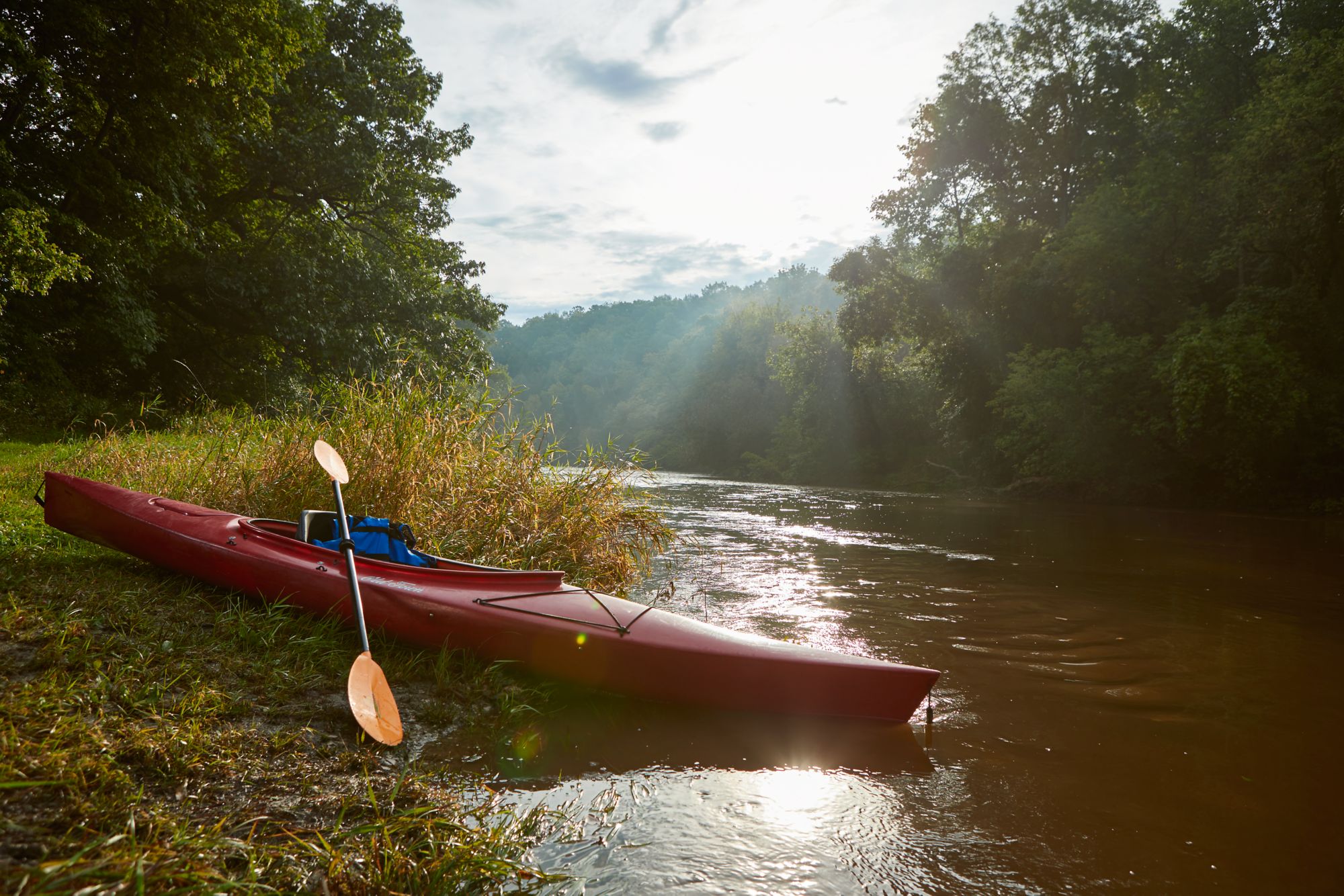 a kayak on the bank of the sheboygan river
