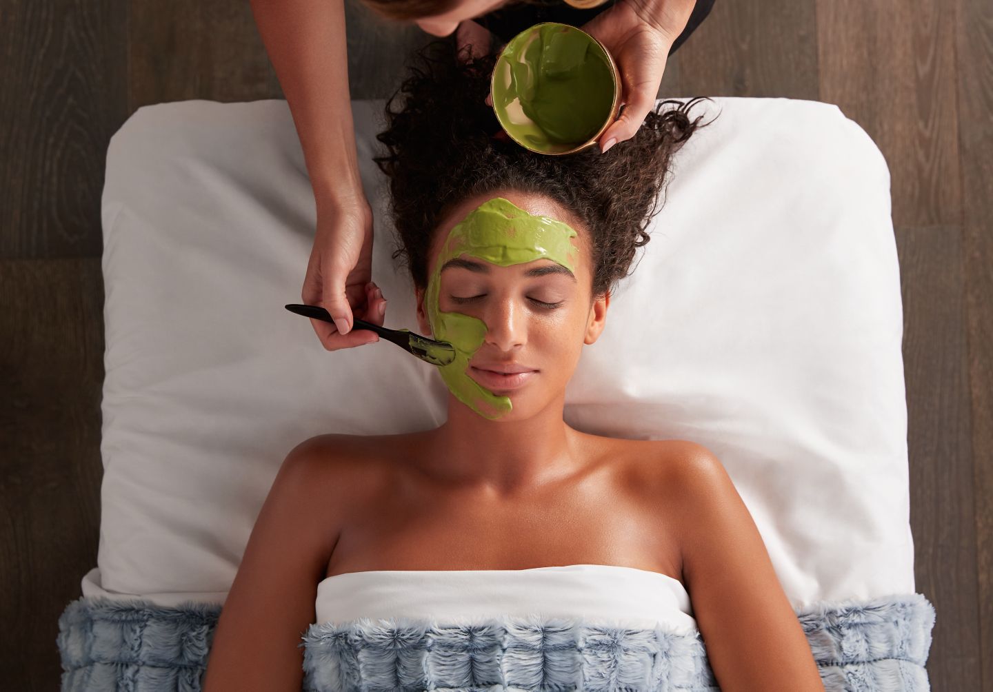 a lady receiving a spa facial