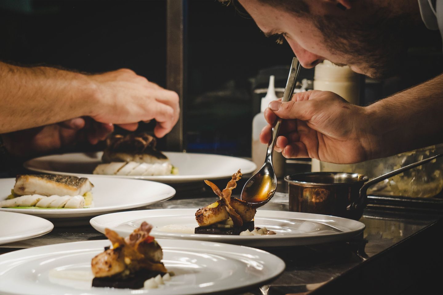 Chef plating the food in the Old Course Hotel, Golf Resort & Spa