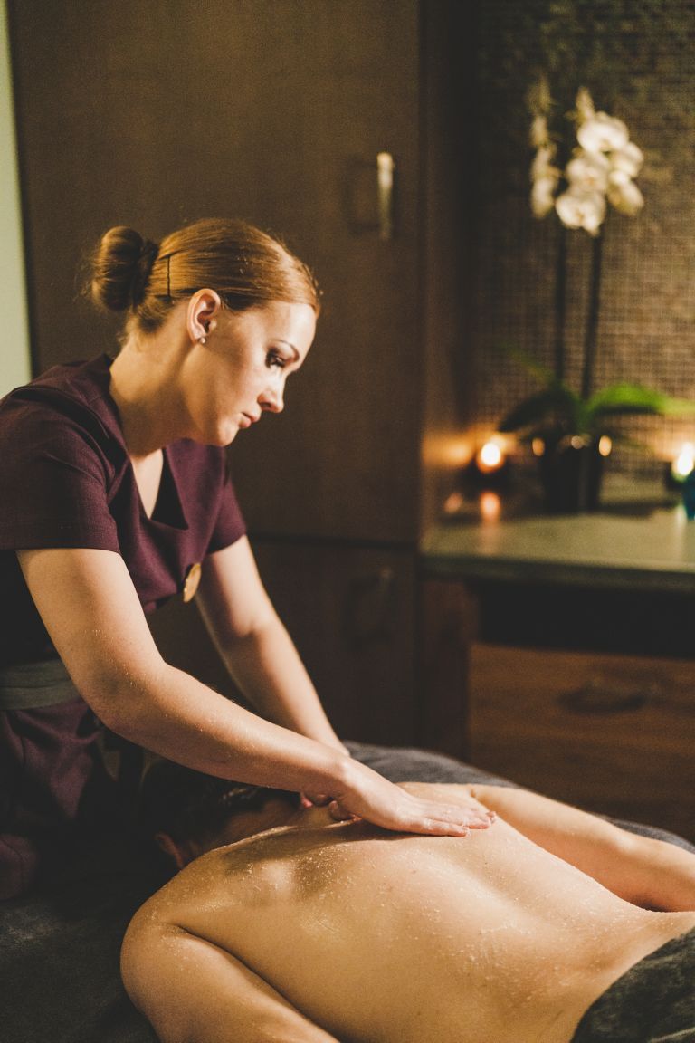 Spa therapist in Kohler Waters Spa while giving a massage