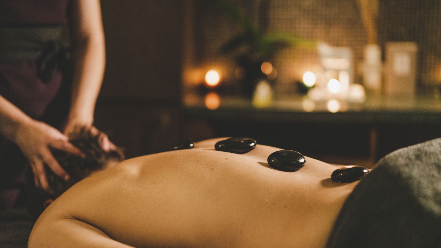 Relaxing hot stone massage at Kohler Waters Spa