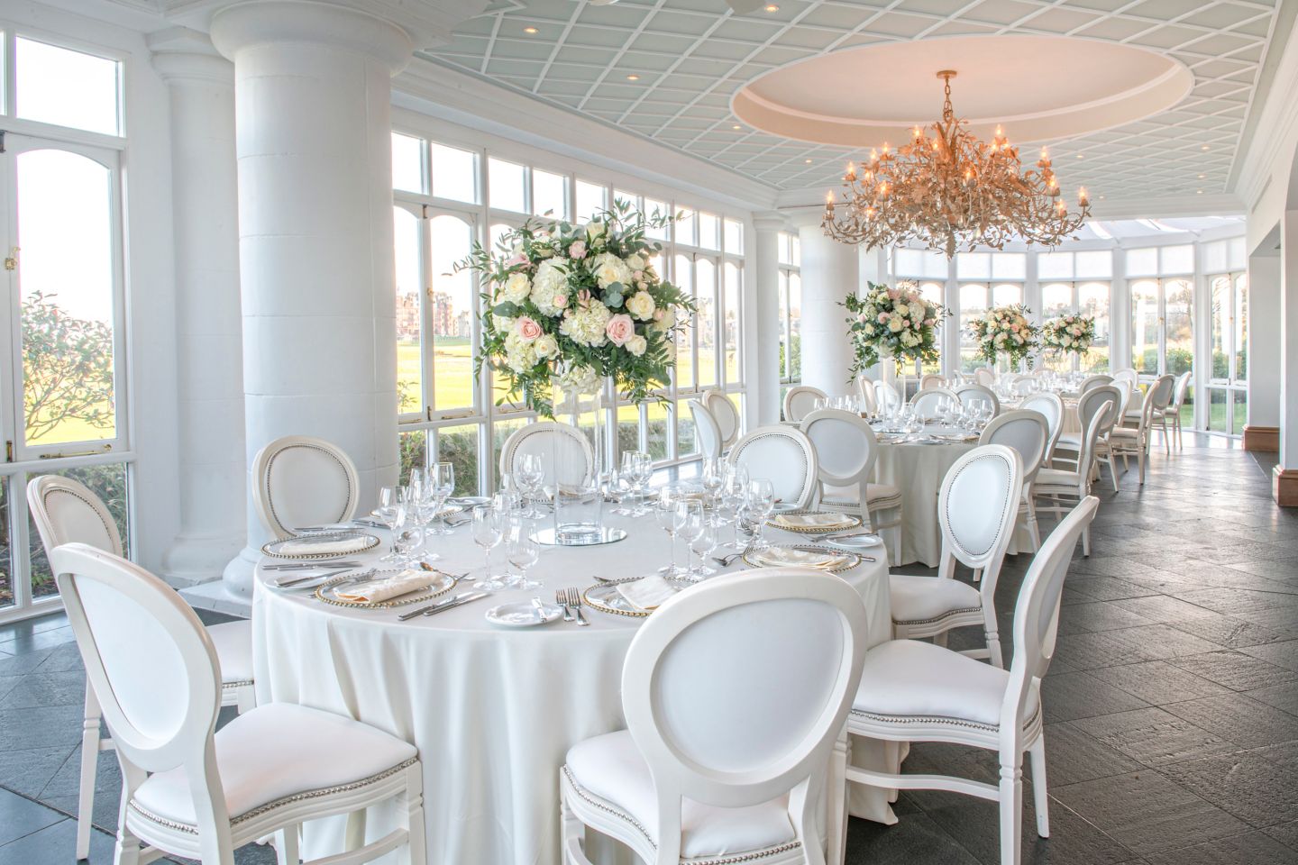 Wedding dinner in the Conservatory. View our wedding ceremony and reception spaces at the Old Course Hotel, Golf Resort & Spa