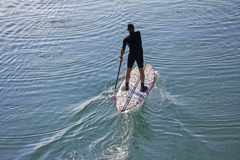 Man paddle boarding
