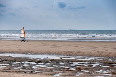 Sand surfing on West Sands Beach