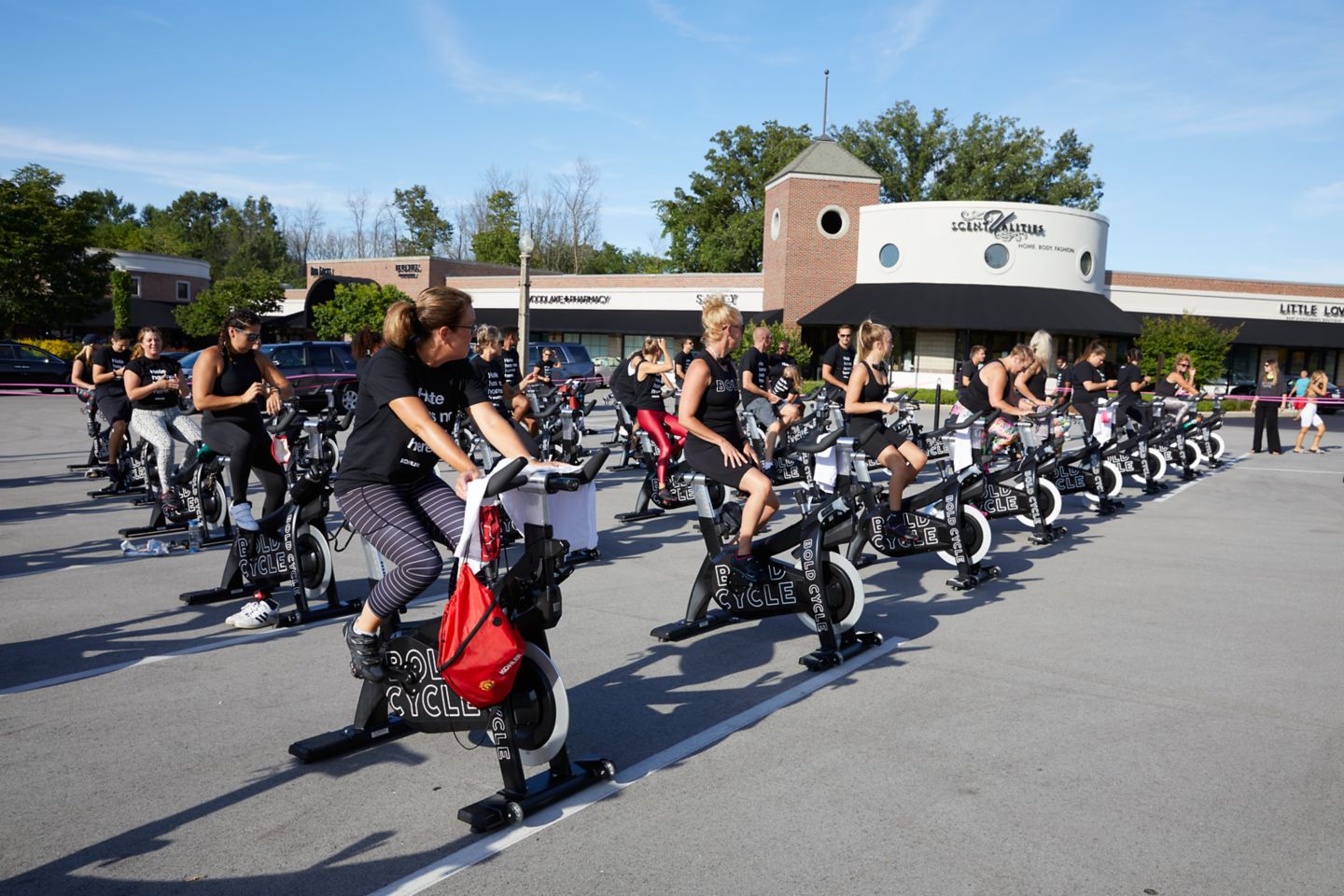 an outdoor cycling class on stationary bikes