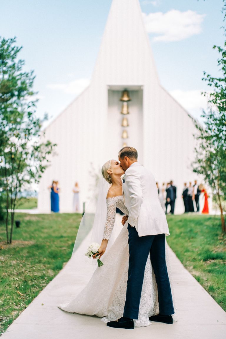 A bride and groom leaving the Straits Chapel