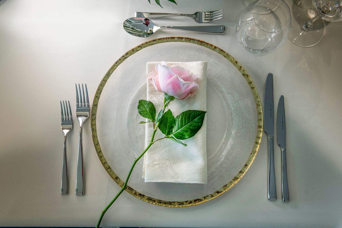 Pink rose on a dinner plate