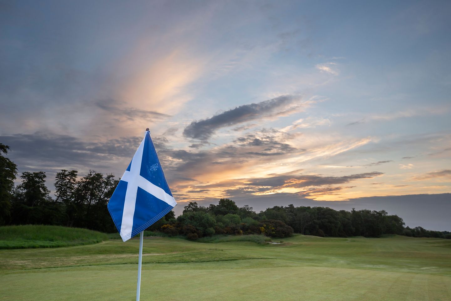 Close up of flag late afternoon The Duke's golf course, St Andrews