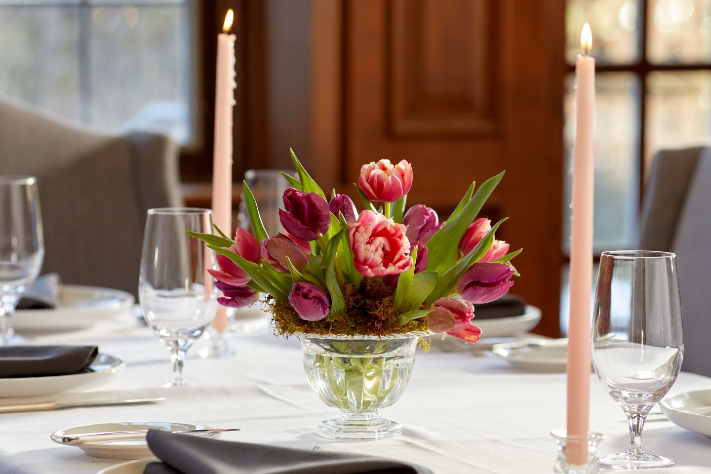 a floral arrangement on a table setting