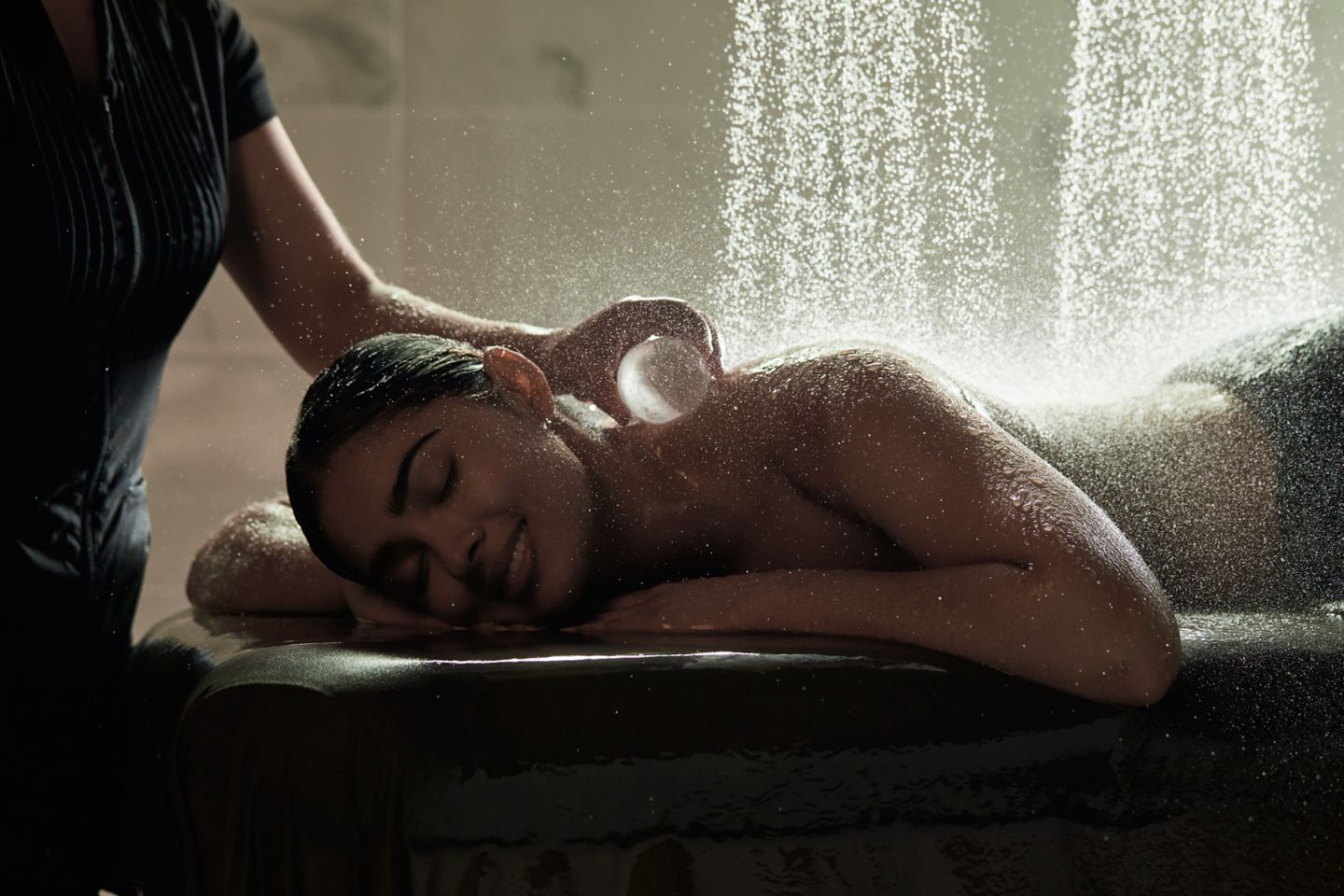 a lady receiving a hydrotherapy treatment