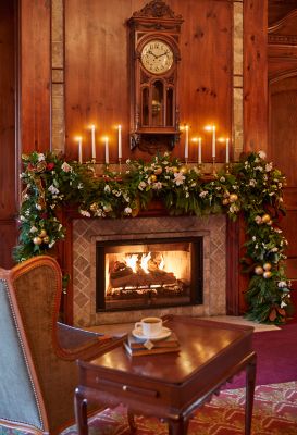 A fireplace with holiday decor