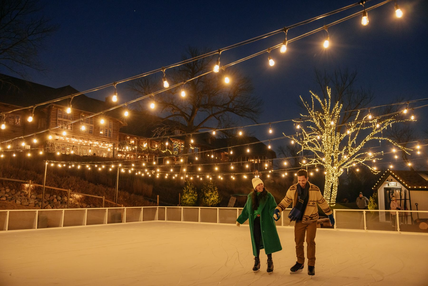 a couple ice skating at frozen fairways